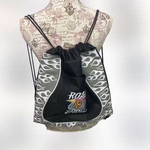 Stylish drawstring backpack.  It has a front pocket and a side zippered pocket